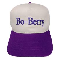 White hat with a purple bill, Bo-Berry shows on the front in purple font. 